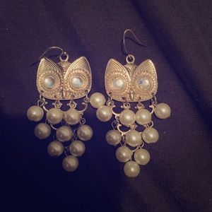 Gold owl earrings.